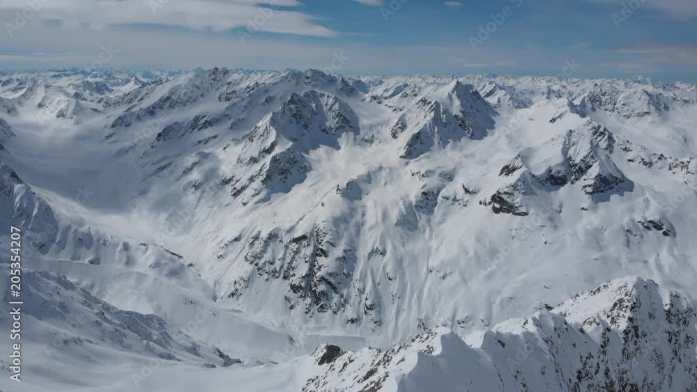 Aerial shot of snow-caped peaks and glaciers of Alps in Tyrol, Austria Aerial shot of snow-caped peaks and glaciers of Alps in Tyrol, Austria