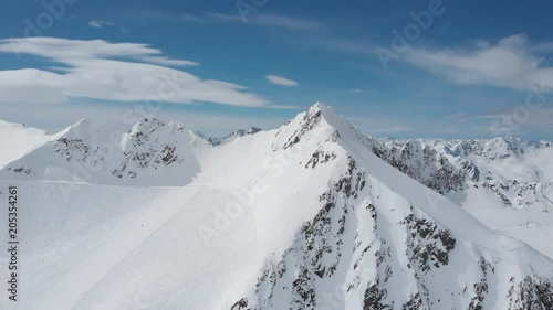Aerial reveal shot of Alps over Pitztal glacier in Tyrol, Austria