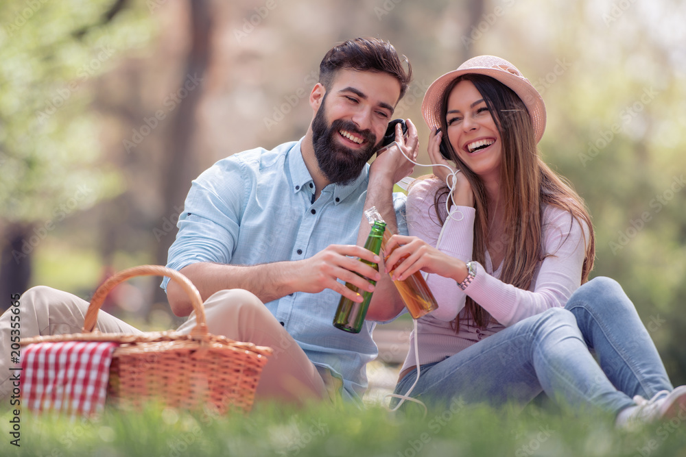 Fototapeta premium Young couple in love having fun and enjoying in nature