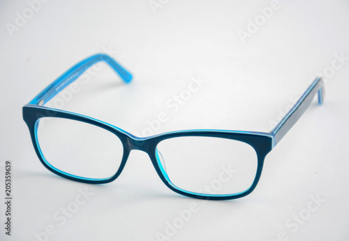 glasses rectangular in blue frame on a light background