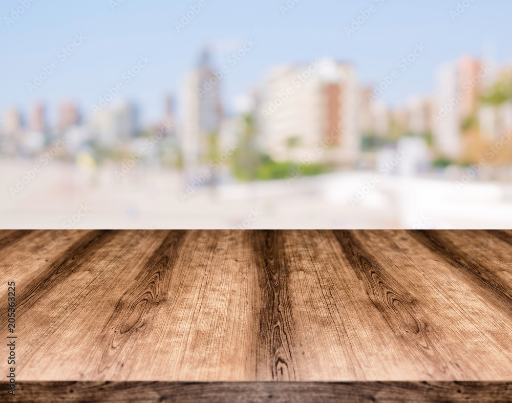 Wooden empty table board in front of blurred background. Can be used for display or montage any product. Mock up for display your product.