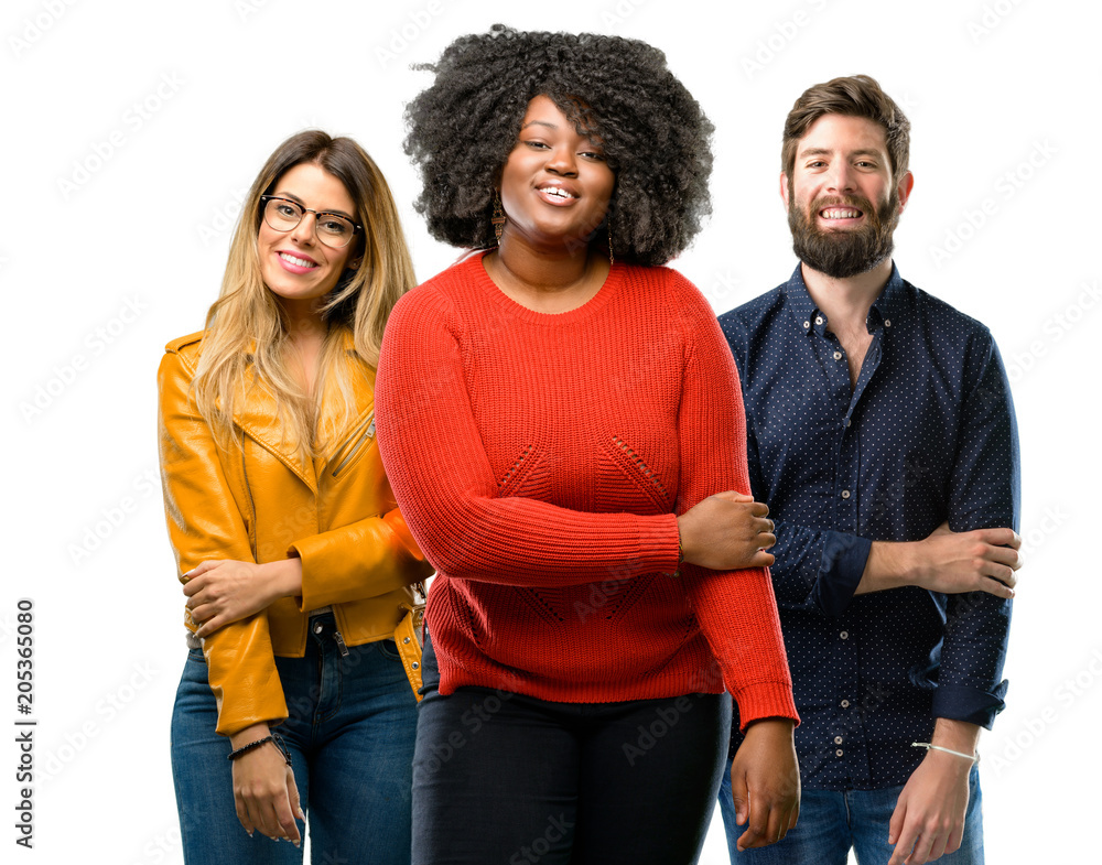 Group of three young men and women confident and happy with a big natural smile laughing Group of three young men and women confident and happy with a big natural smile laughing