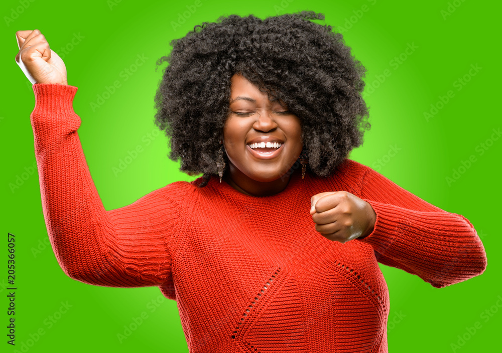 Beautiful african woman happy and excited expressing winning gesture. Successful and celebrating victory, triumphant Beautiful african woman happy and excited expressing winning gesture. Successful and celebrating victory, triumphant