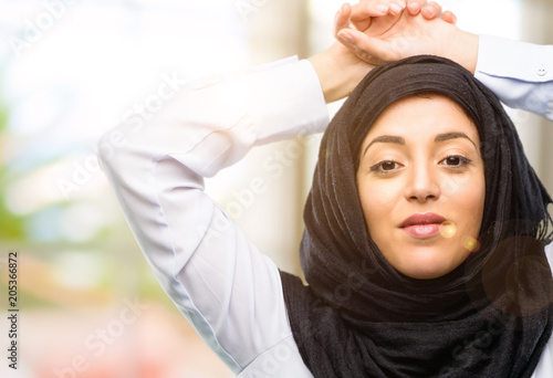 Young arab woman wearing hijab confident and happy with a big natural smile