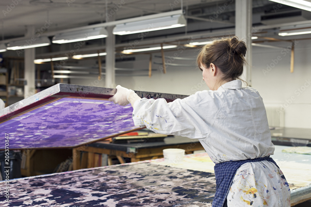 Textile designers working in workshop Textile designers working in workshop