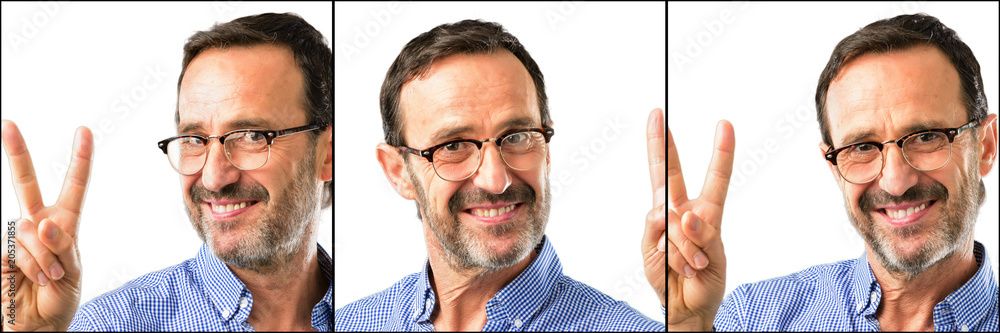 Middle age handsome man closeup raising fingers, number two Middle age handsome man closeup raising fingers, number two