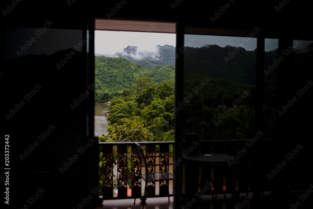 view from the window to the mountains and river view from the window to the mountains and river
