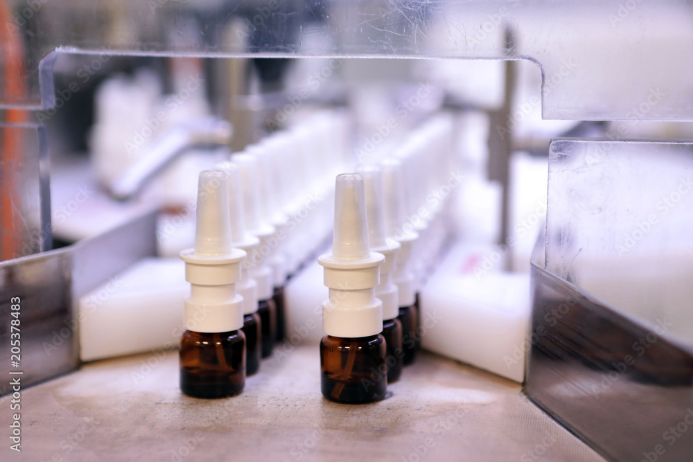 The production line of the medicine. Filling interferon in bottl The production line of the medicine. Filling interferon in bottl