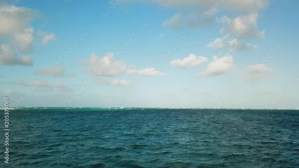 Low Elevation: Peaceful Blue Ocean in Punta Cana Low Elevation: Peaceful Blue Ocean in Punta Cana