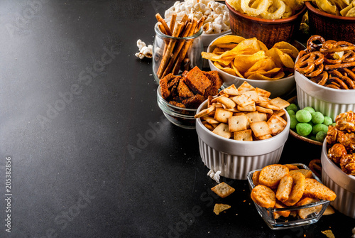 Fotografie, Obraz Variation different unhealthy snacks crackers, sweet salted popcorn, tortillas,