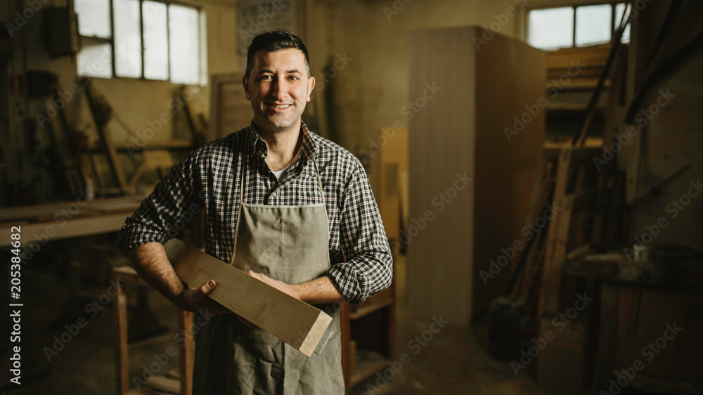 Image of mature carpenter in the workshop