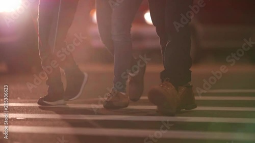 Slow motion shot of Unidentified people cross night street in Taipei, Taiwan