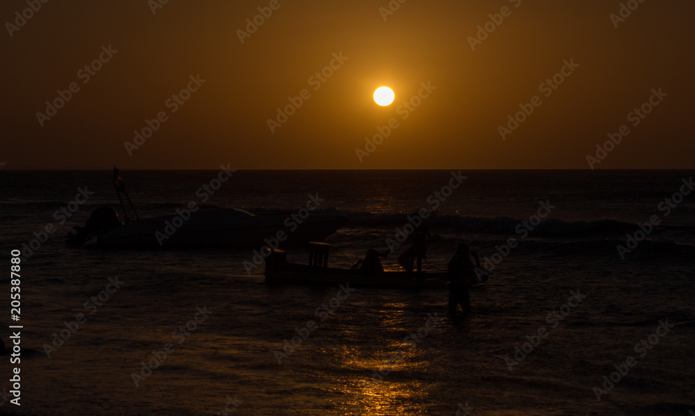 Silhouette people at sunset on the beach - Jericoacoara - Brazil
