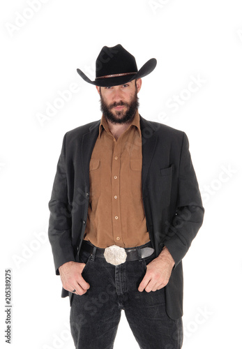 Man in gray jacket and cowboy hat, hand in pocket