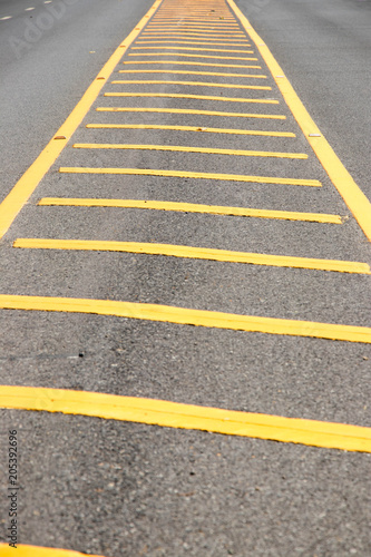 Yellow color road line on asphalt background