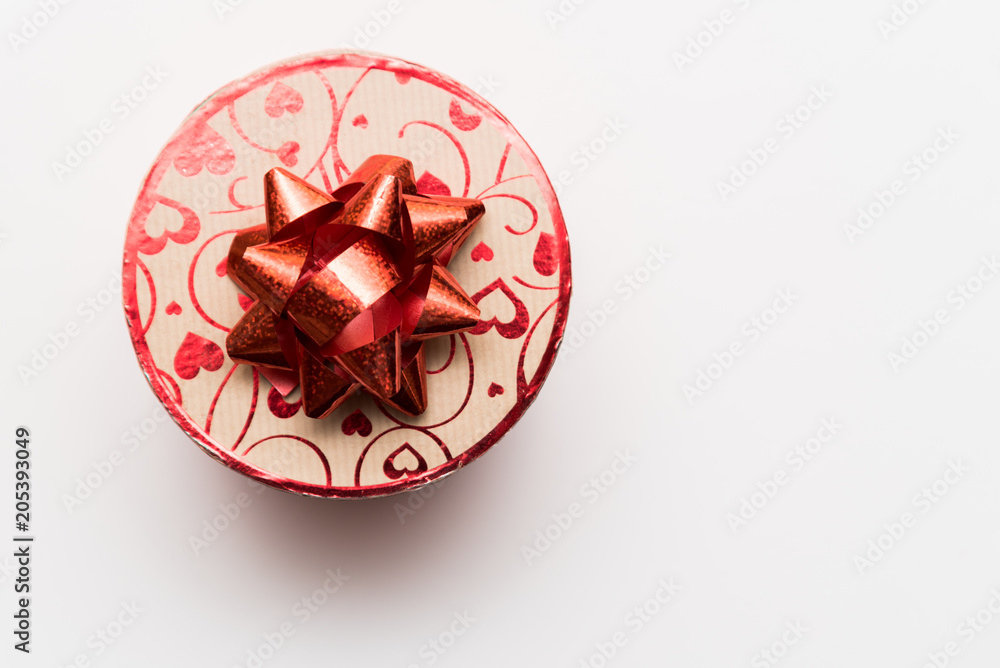 A circle plain present gift box with love heart pattern on top A circle plain present gift box with love heart pattern on top