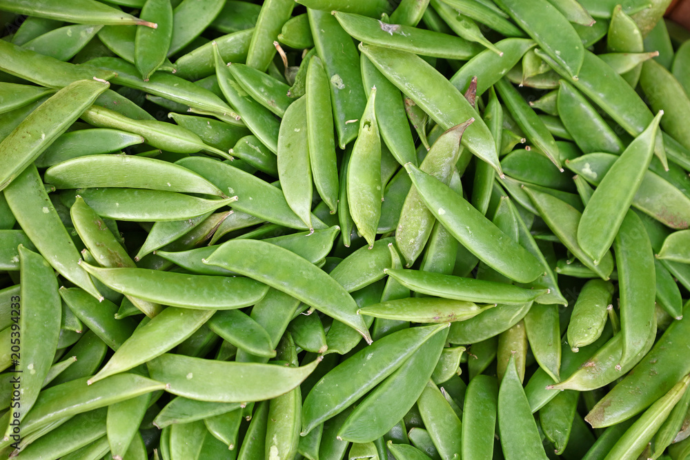 Close up green peas pods on retail display Close up green peas pods on retail display