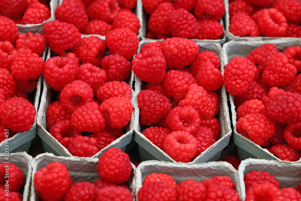 Close up red ripe raspberry on retail display Close up red ripe raspberry on retail display