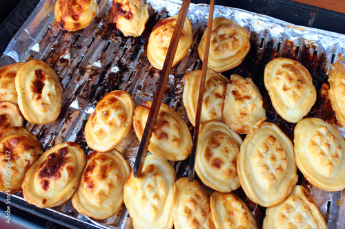 Traditional small Polish oscypek (fried sheep cheese) at street stall in Lublin, Poland