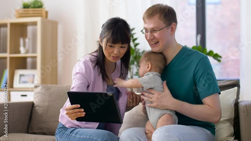 Wallpaper Mural family, parenthood and technology concept - happy mother, father and baby boy with tablet pc computer having video chat at home Torontodigital.ca