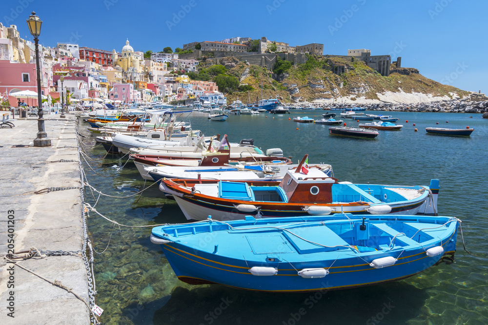 Marina Corricella with colourful boats and houses, Terra Murata, Procida Island, Bay of Naples, Italy.