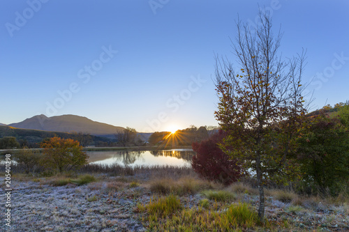Sunrise at the water in autumn