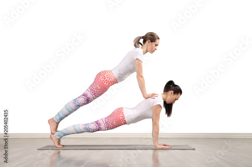 Young female acrobats in beautiful acrobatic poses