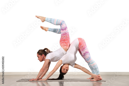 Young female acrobats in beautiful acrobatic poses