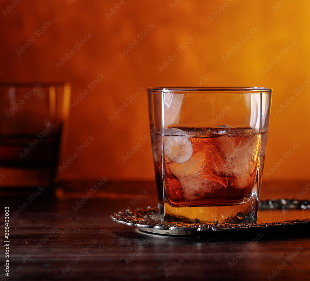 Glass of scotch whiskey and natural ice . Glass of scotch whiskey and natural ice .