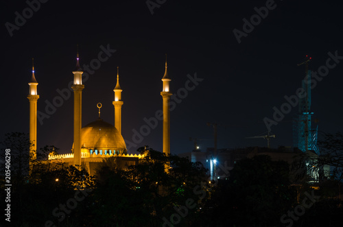The National Mosque of Abuja illuminated during the night