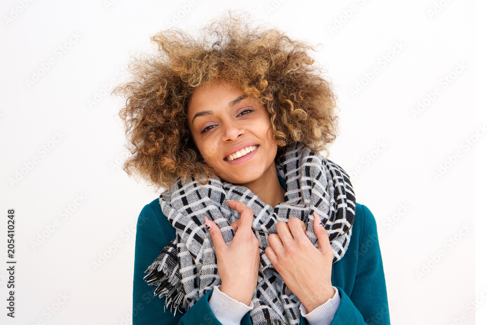 beautiful african american girl smiling with winter coat and scarf against white background beautiful african american girl smiling with winter coat and scarf against white background