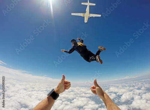 Skydiver Cloudscape jump out of plane