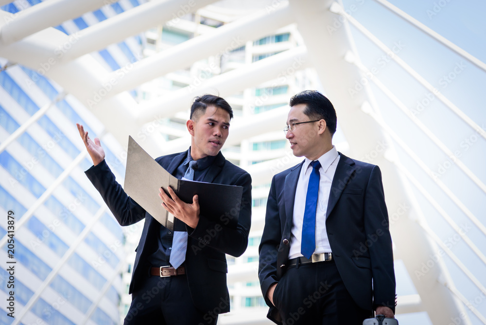 Two asian businessman has talking for business vision. Two asian businessman has talking for business vision.