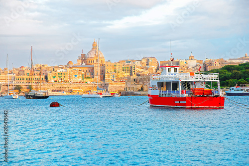 Valletta Skyline with St Paul Cathedral and ferry boat