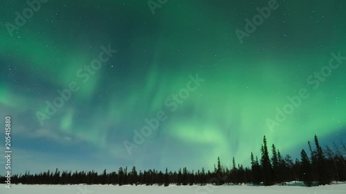Time lapse of Aurora Borealis (Northern Lights) over lake Pallasjärvi in Pallas-Yllästunturi National Park, Lapland, Finland