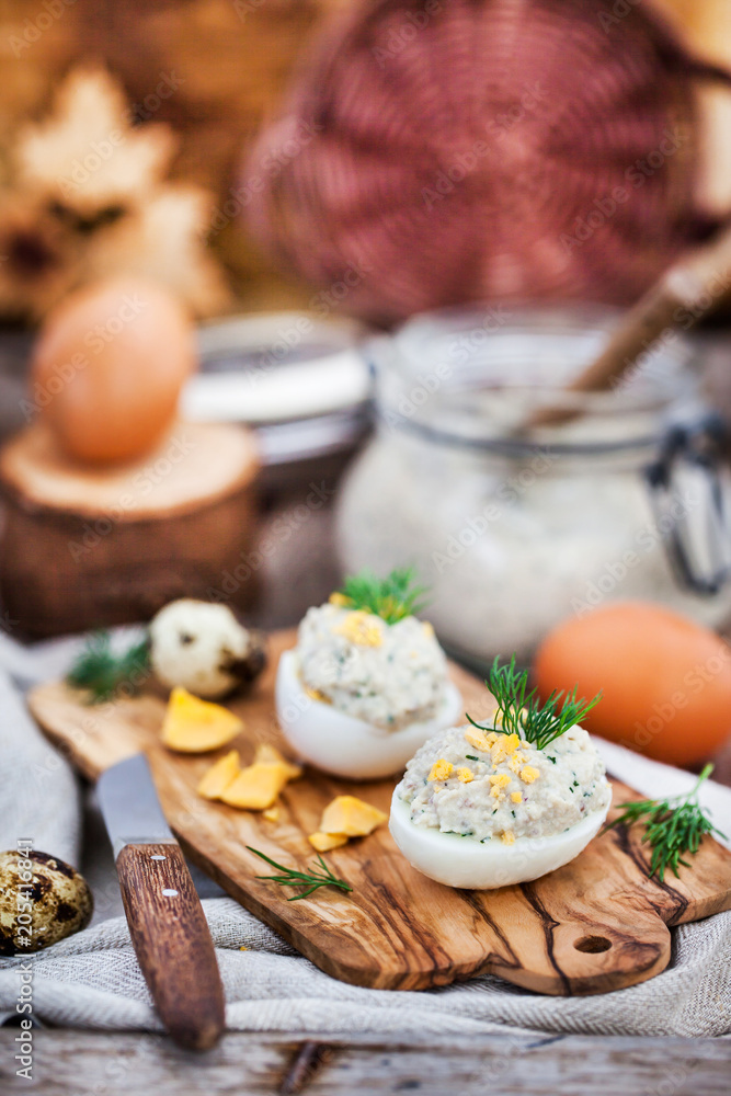 Eggs stuffed with herring creamy pate on wooden rustic background Eggs stuffed with herring creamy pate on wooden rustic background