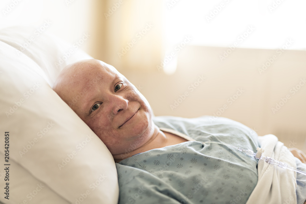 woman in hospital bed suffering from cancer