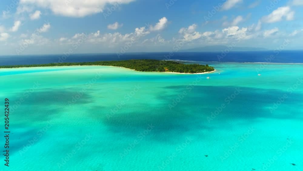 Aerial view of tropical paradise of Bora Bora island, crystal clear water of scenic turquoise blue lagoon - South Pacific Ocean, French Polynesia, 4k UHD Aerial view of tropical paradise of Bora Bora island, crystal clear water of scenic turquoise blue lagoon - South Pacific Ocean, French Polynesia, 4k UHD