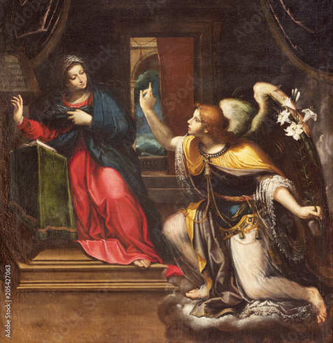 REGGIO EMILIA, ITALY - APRIL 13, 2018: The detail of painting of Annunciation in chruch Chiesa di Santi Giacomo e Filippo apostoli by unknown artist.