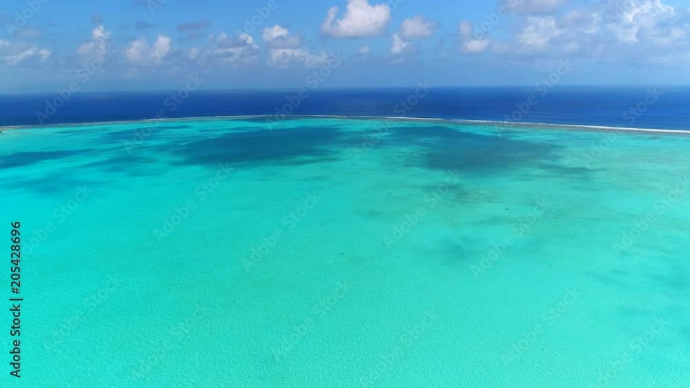 Aerial view of tropical paradise of Bora Bora island, crystal clear water of scenic turquoise blue lagoon - South Pacific Ocean, French Polynesia, 4k UHD Aerial view of tropical paradise of Bora Bora island, crystal clear water of scenic turquoise blue lagoon - South Pacific Ocean, French Polynesia, 4k UHD