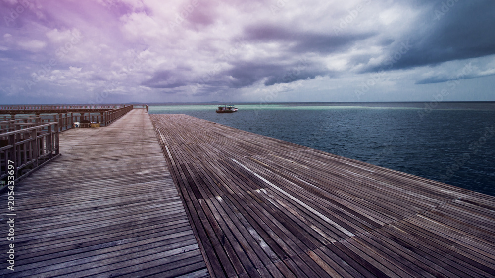 Wooden Beach Dock or Wooden Pier at Beautiful Tropical Sea