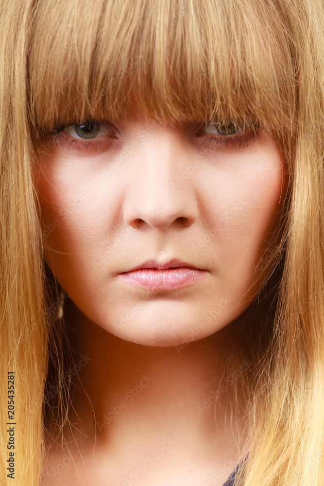Angry looking woman, face covered in fringe Angry looking woman, face covered in fringe