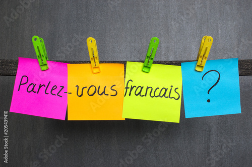 Colorful notes with question Do you speak French on the dark background.