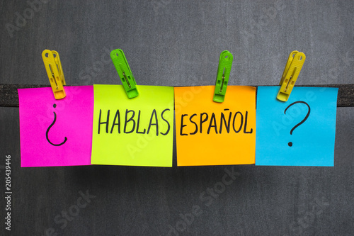 Colorful notes with question Do you speak Spanish on the dark background.