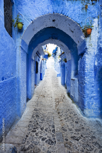 vertical view to tunnel on the blue street in old city in Morocco © sergejson
