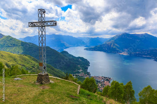 Iron cross on the mountain by the village Camaggiore overlooking the Como lake, Italy