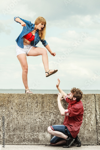 Young couple in love fighting outdoor