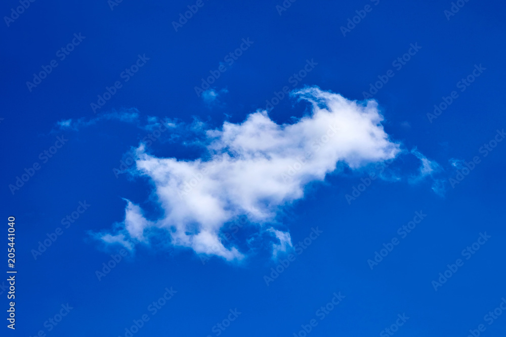 lonely white fluffy cloud on blue sky background lonely white fluffy cloud on blue sky background