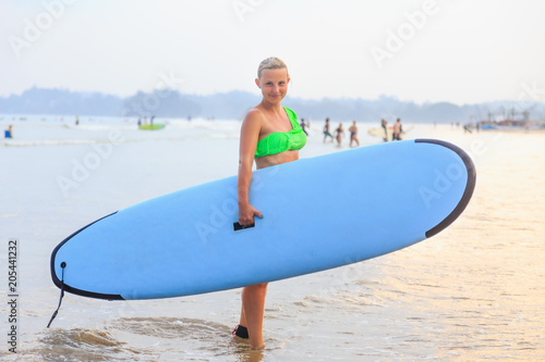 Girl with blue surfboard