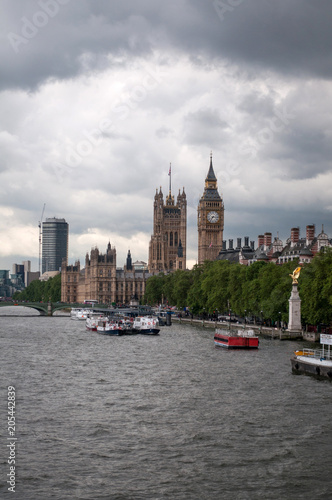 The British Parliament, and the Big Bens clock at the Thames River in Westminster - London, United Kingdom